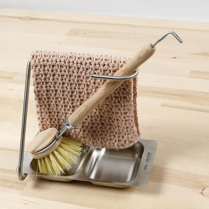 Un gant de vaisselle au crochet avec un motif style coquillage